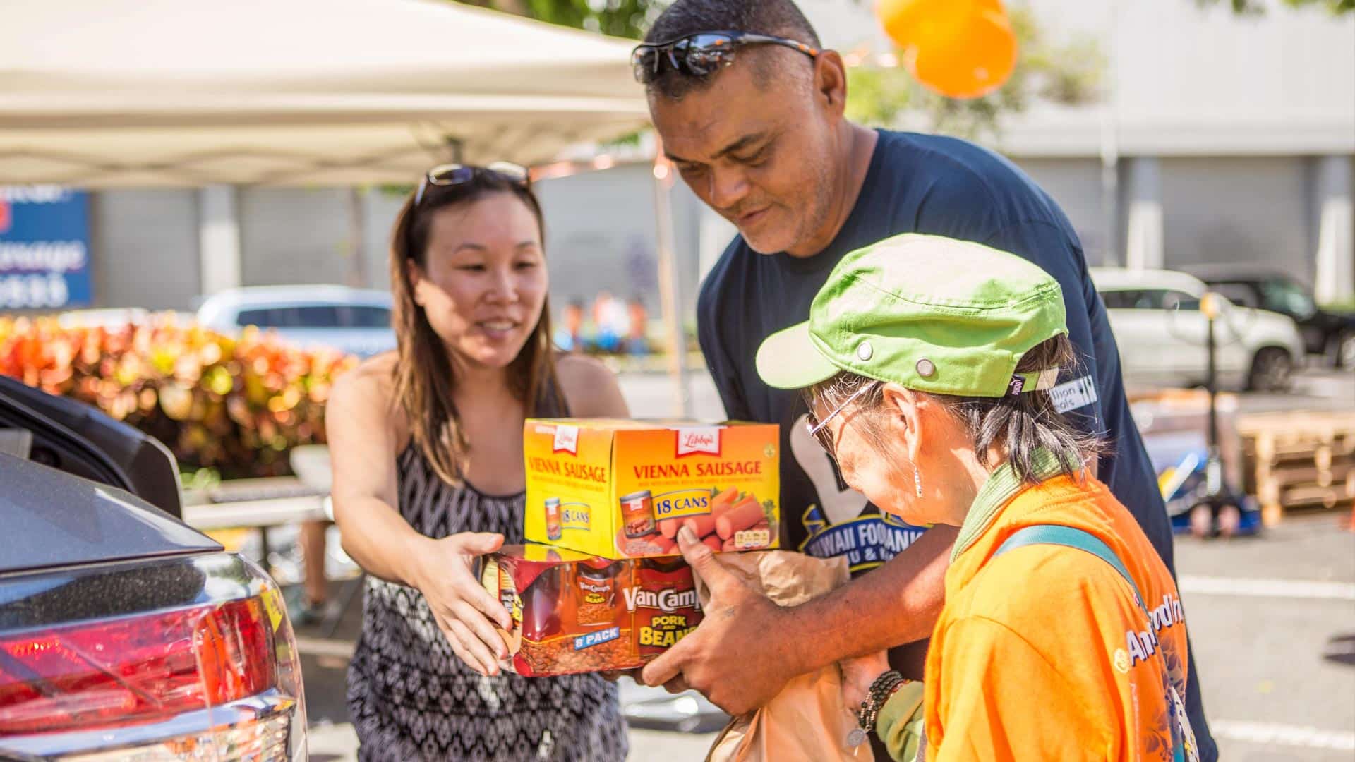 Hawaii Foodbank volunteers providing nourishment and hope, handing out food to residents in need.